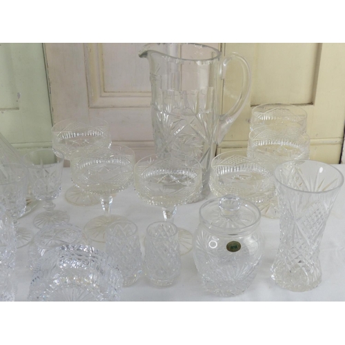 17 - A large assortment of crystal to include a set of three Tyrone crystal vases, a ships decanter, a Ty... 