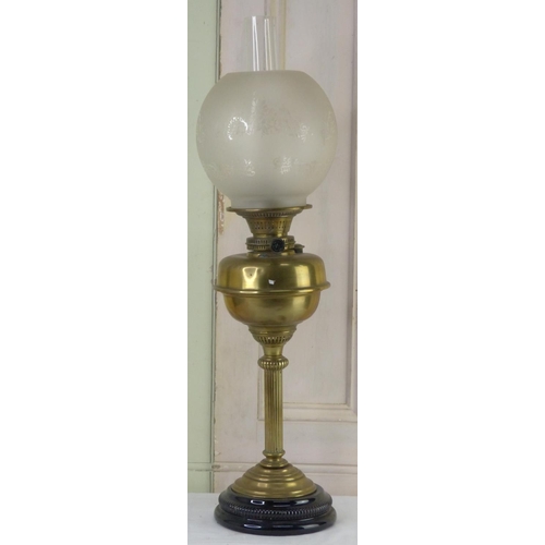 20 - A vintage oil lamp with etched glass shade