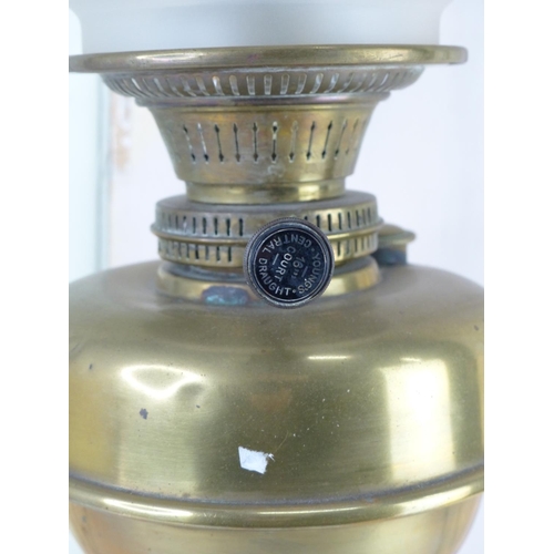 20 - A vintage oil lamp with etched glass shade