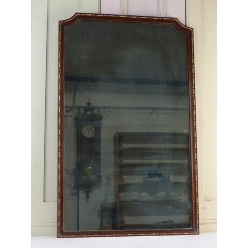 29 - A mahogany and gilt framed wall mirror, 72cm x 45cm.