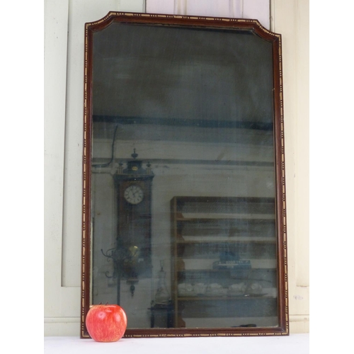 29 - A mahogany and gilt framed wall mirror, 72cm x 45cm.
