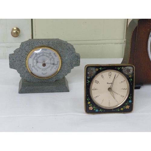 3 - A vintage Westclox floral enamel alarm clock and three others.