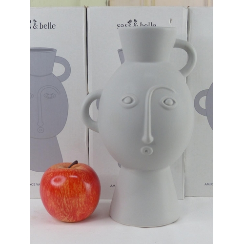 32 - Seven boxed Sass & Belle Amira Face vase with handles.