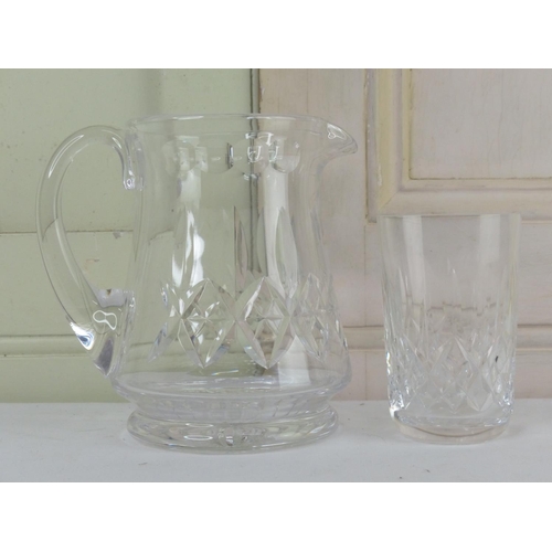 35 - A Stuart crystal water jug and a crystal beaker (a/f).