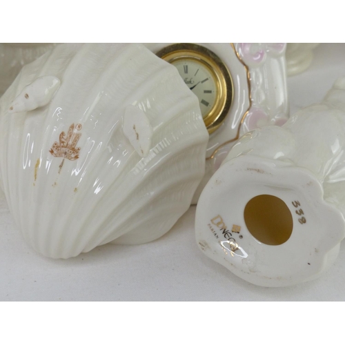 50 - A Belleek pottery flower encrusted vase and jug and more.