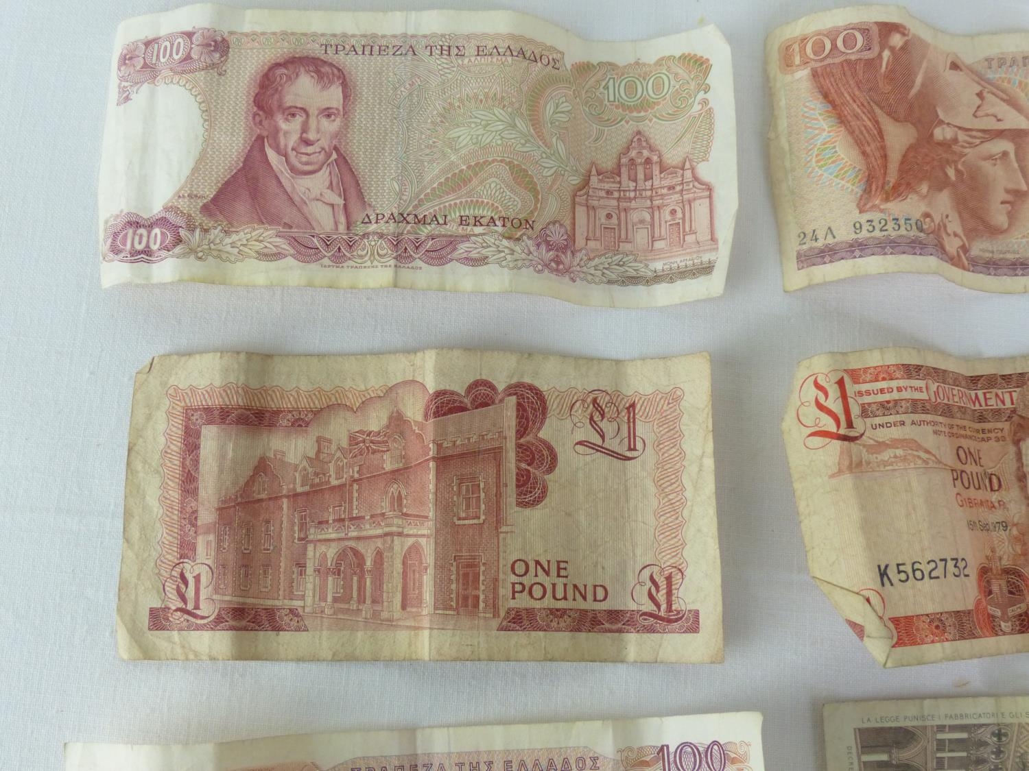 Seven vintage bank notes.