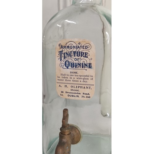 42 - An antique pharmacy bottle with original paper label for Ammoniated Tincture of Quinine.