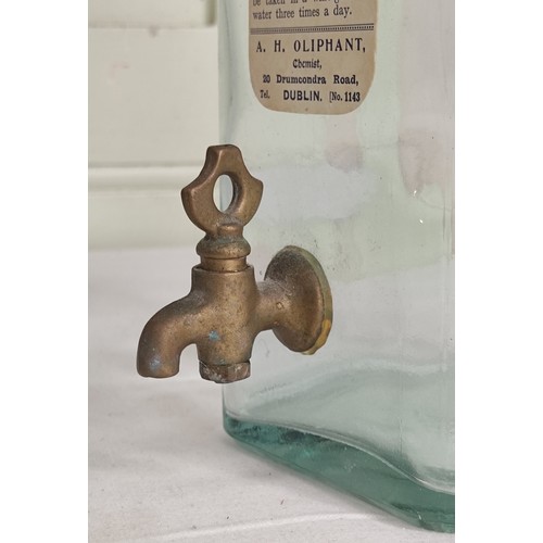 42 - An antique pharmacy bottle with original paper label for Ammoniated Tincture of Quinine.