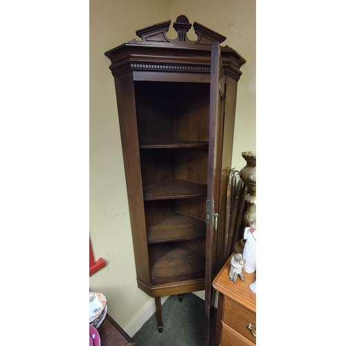 1 - An antique/ Edwardian corner cabinet on spade feet. Measuring approx 193cm tall