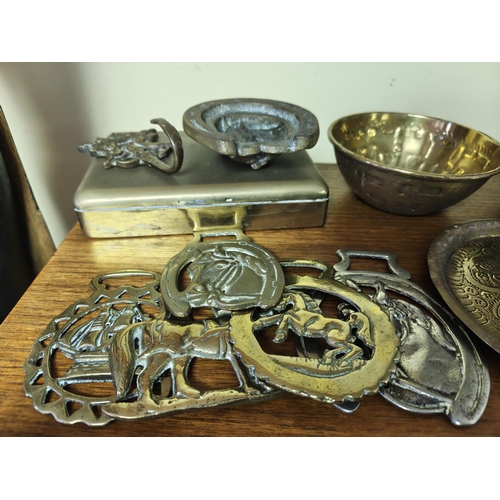 31 - An assortment of brassware, to include horse brasses, decorative bowls & more.