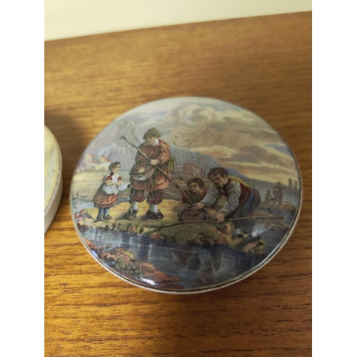 38 - A pair of decorative pot lids/ plaques.