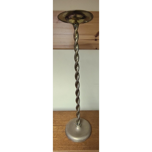 41 - A vintage floor standing brass ashtray with barley twist column. Measuring approx 57cm