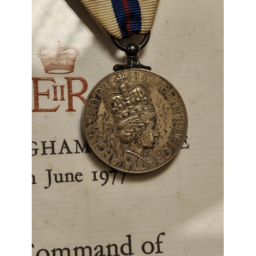 56 - A Queen Elizabeth Silver Jubilee medal with framed certificate.