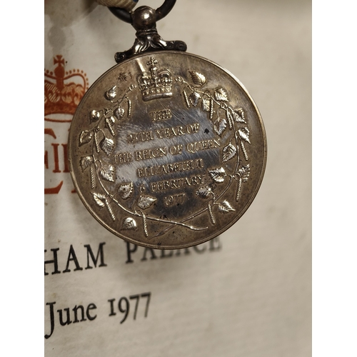 56 - A Queen Elizabeth Silver Jubilee medal with framed certificate.