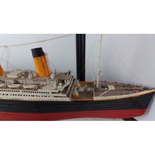 1 - Model of the RMS Titanic (1912), detailed with four funnels, deck fittings, lifeboats and rigging, f... 