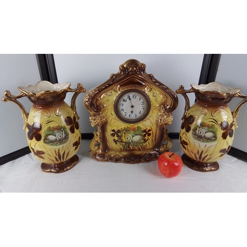 22 - Three-piece clock & garniture set, comprising a pair of twin-handled vases and a matching mantel clo... 