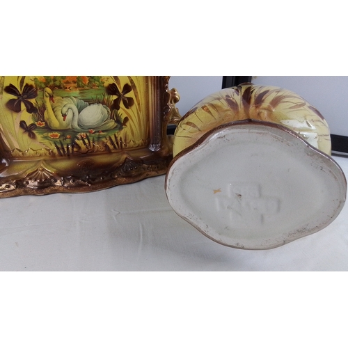 22 - Three-piece clock & garniture set, comprising a pair of twin-handled vases and a matching mantel clo... 