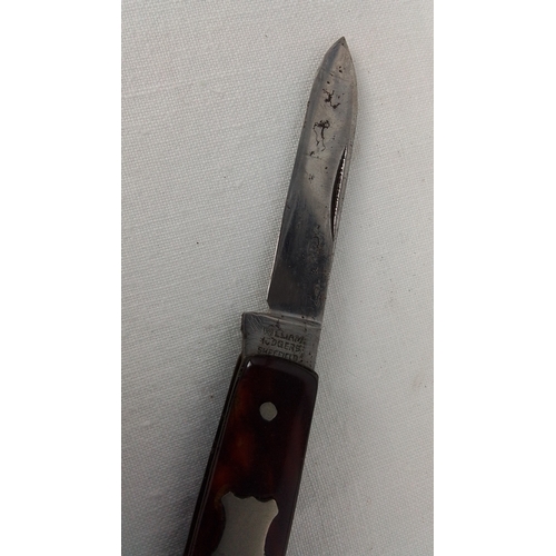 27 - A William Rodgers, Sheffield two-blade folding pocket knife with tortoiseshell-effect scales, vacant... 