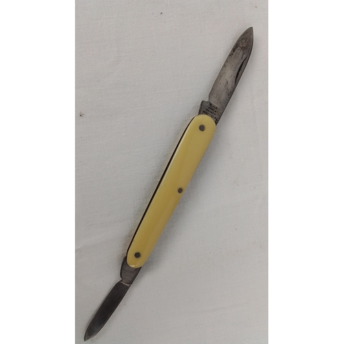30 - A pocket knife James Barber, Sheffield, with two folding steel blades and cream-coloured handles, ac... 