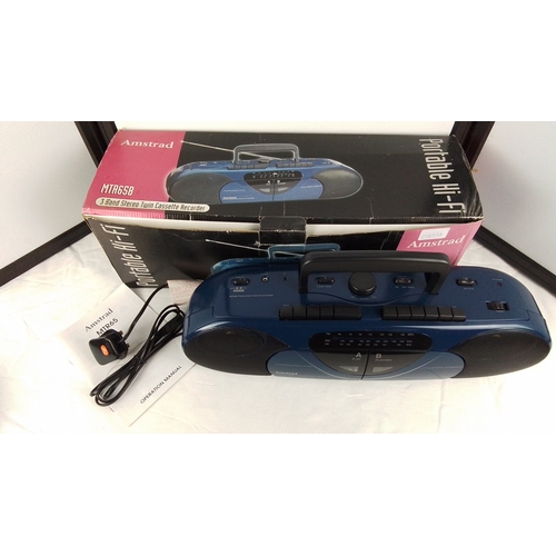 36 - An Amstrad MTR65B portable stereo radio cassette recorder, three-band (FM/MW/LW), with twin cassette... 