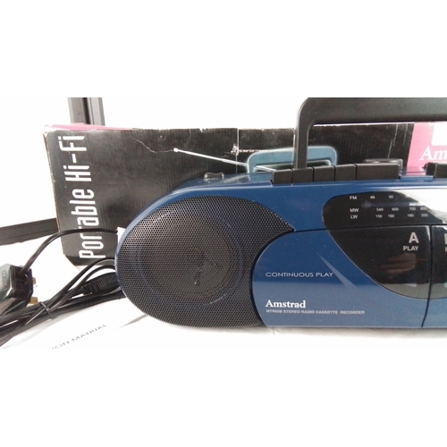 36 - An Amstrad MTR65B portable stereo radio cassette recorder, three-band (FM/MW/LW), with twin cassette... 