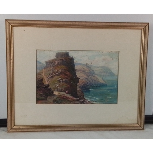 42 - A framed watercolour 'Castle Rock, Lynton, Devon' of a coastal cliff landscape with sea and distant ... 