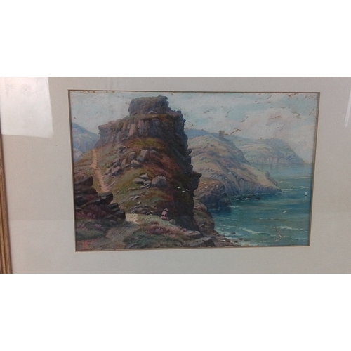 42 - A framed watercolour 'Castle Rock, Lynton, Devon' of a coastal cliff landscape with sea and distant ... 