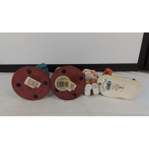 56 - A Royal Doulton and Goebel figures and two others.