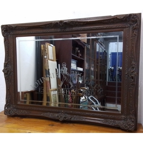 106 - A large rectangular wall mirror with bevelled plate and etched Johnnie Walker advertising motif, wit... 