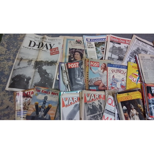 121 - A large collection of 20th-century newspapers and magazines, largely military and wartime themed, in... 
