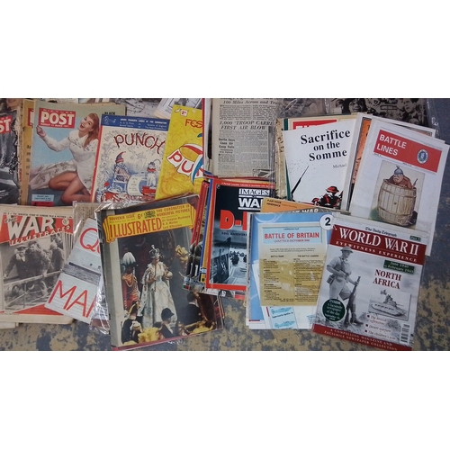 121 - A large collection of 20th-century newspapers and magazines, largely military and wartime themed, in... 