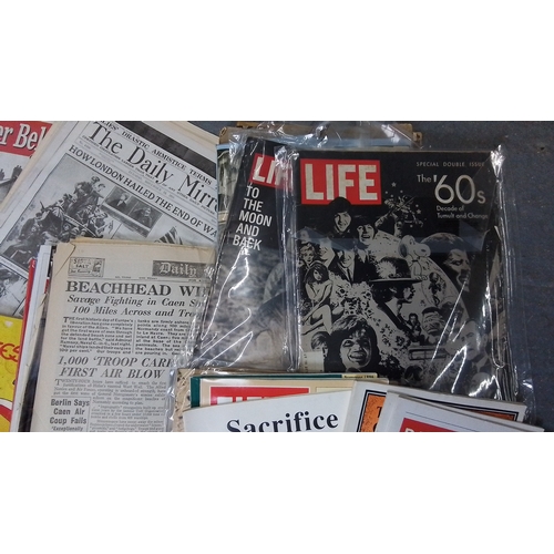 121 - A large collection of 20th-century newspapers and magazines, largely military and wartime themed, in... 