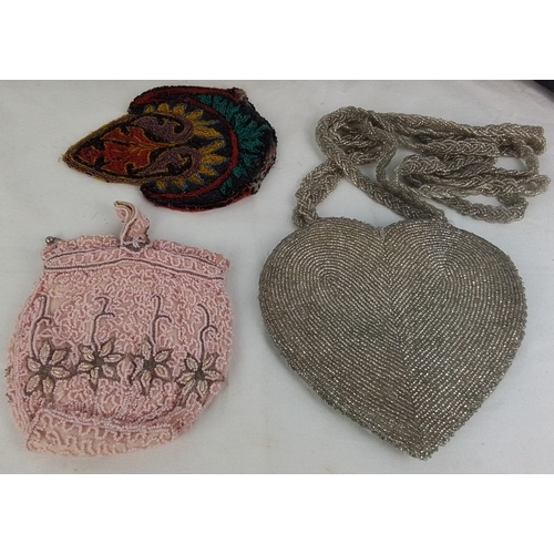 132 - Set of three vintage beaded accessories comprising a silver-tone heart-shaped evening bag with braid... 
