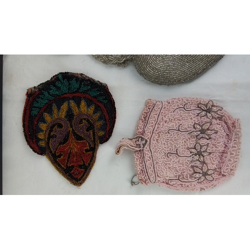 132 - Set of three vintage beaded accessories comprising a silver-tone heart-shaped evening bag with braid... 