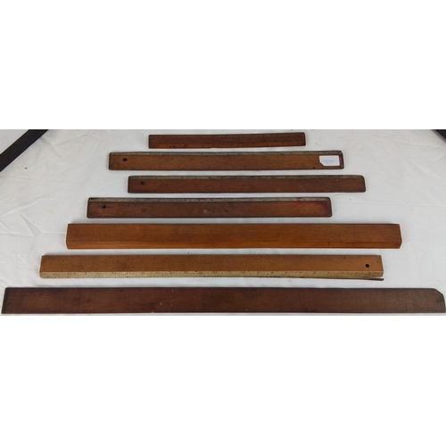 88 - Set of 7 vintage wooden straightedges and measuring rules, including examples with applied inch scal... 