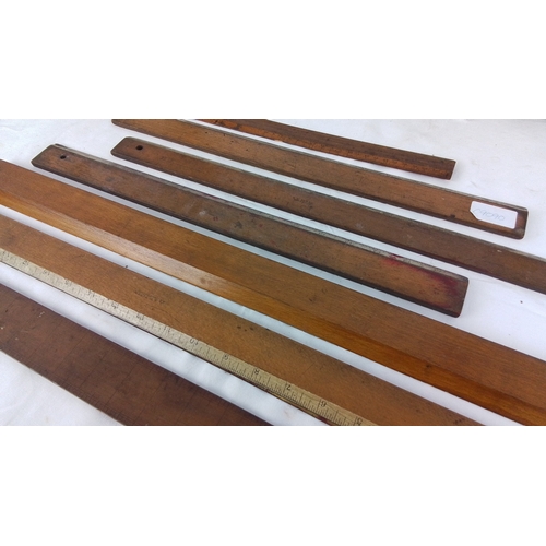88 - Set of 7 vintage wooden straightedges and measuring rules, including examples with applied inch scal... 