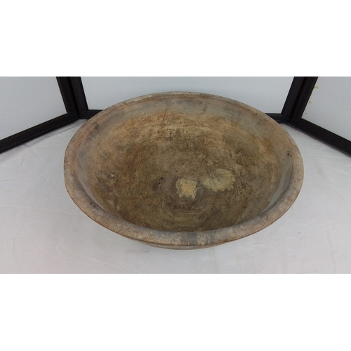 146 - An Irish hand-carved wooden dough bowl or trough, of elliptical form with thick rim and deep interio... 