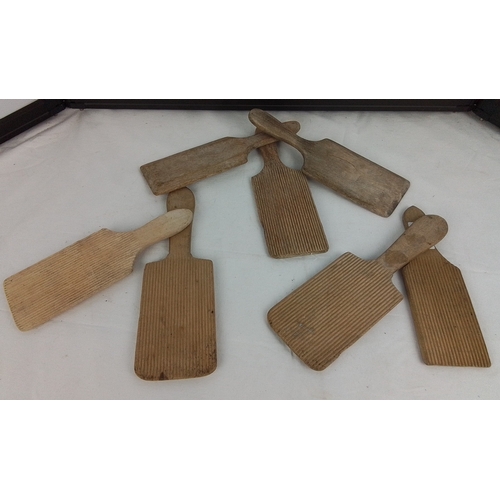 151 - Collection of 7 antique wooden butter pats.