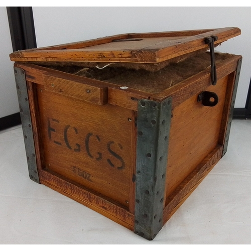 152 - An early 20th century EGGS merchant’s wooden transit crate, with iron corner straps and hasp fastene... 