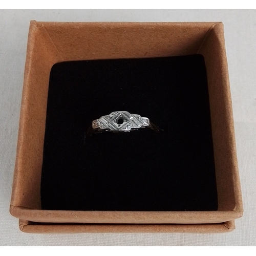 183 - A vintage platinum-fronted 9ct gold dress ring, the geometric head with engraved decoration and a ce... 