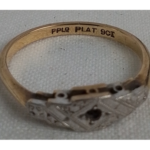 183 - A vintage platinum-fronted 9ct gold dress ring, the geometric head with engraved decoration and a ce... 