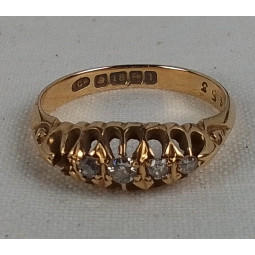 184 - A 18ct gold five-stone diamond ring, the graduated round brilliant stones in pierced gallery setting... 