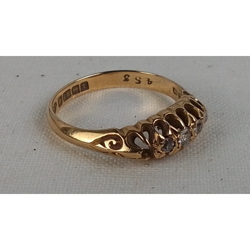 184 - A 18ct gold five-stone diamond ring, the graduated round brilliant stones in pierced gallery setting... 