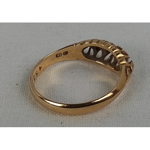 184 - A 18ct gold five-stone diamond ring, the graduated round brilliant stones in pierced gallery setting... 