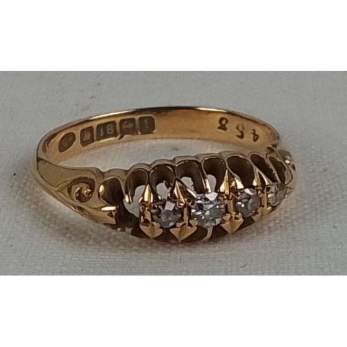 184 - A 18ct gold five-stone diamond ring, the graduated round brilliant stones in pierced gallery setting... 