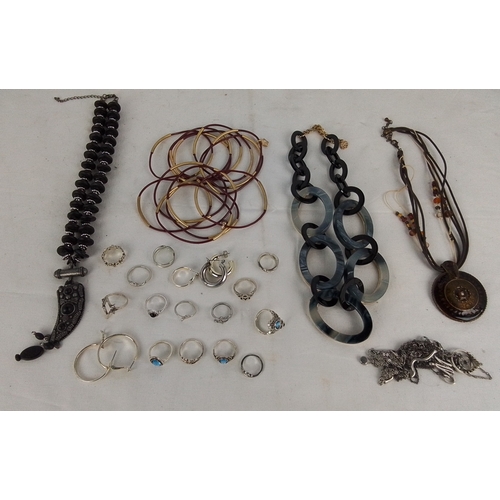 185 - Group of costume jewellery, including a multi-strand black beaded necklace with pendant, a resin-lin... 