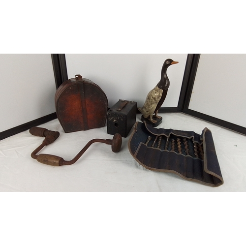 220 - A vintage iron brace drill and parts, a leather oval case containing small accessories, a vest-pocke... 