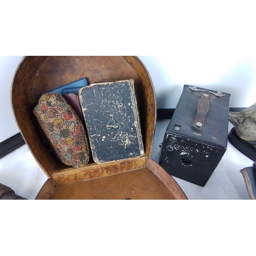 220 - A vintage iron brace drill and parts, a leather oval case containing small accessories, a vest-pocke... 