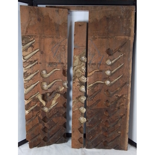 226 - Group of three wooden pipe-moulding forms, each fitted with multiple carved cavities and attached cl... 