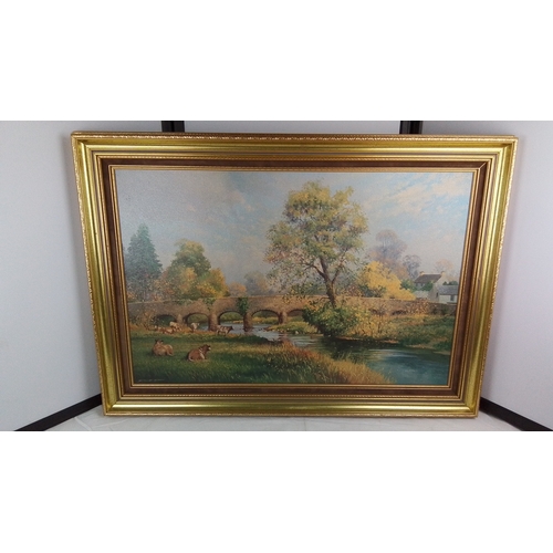 262 - A print of a landscape depicting cattle grazing beside a river with a multi-arched stone bridge and ... 